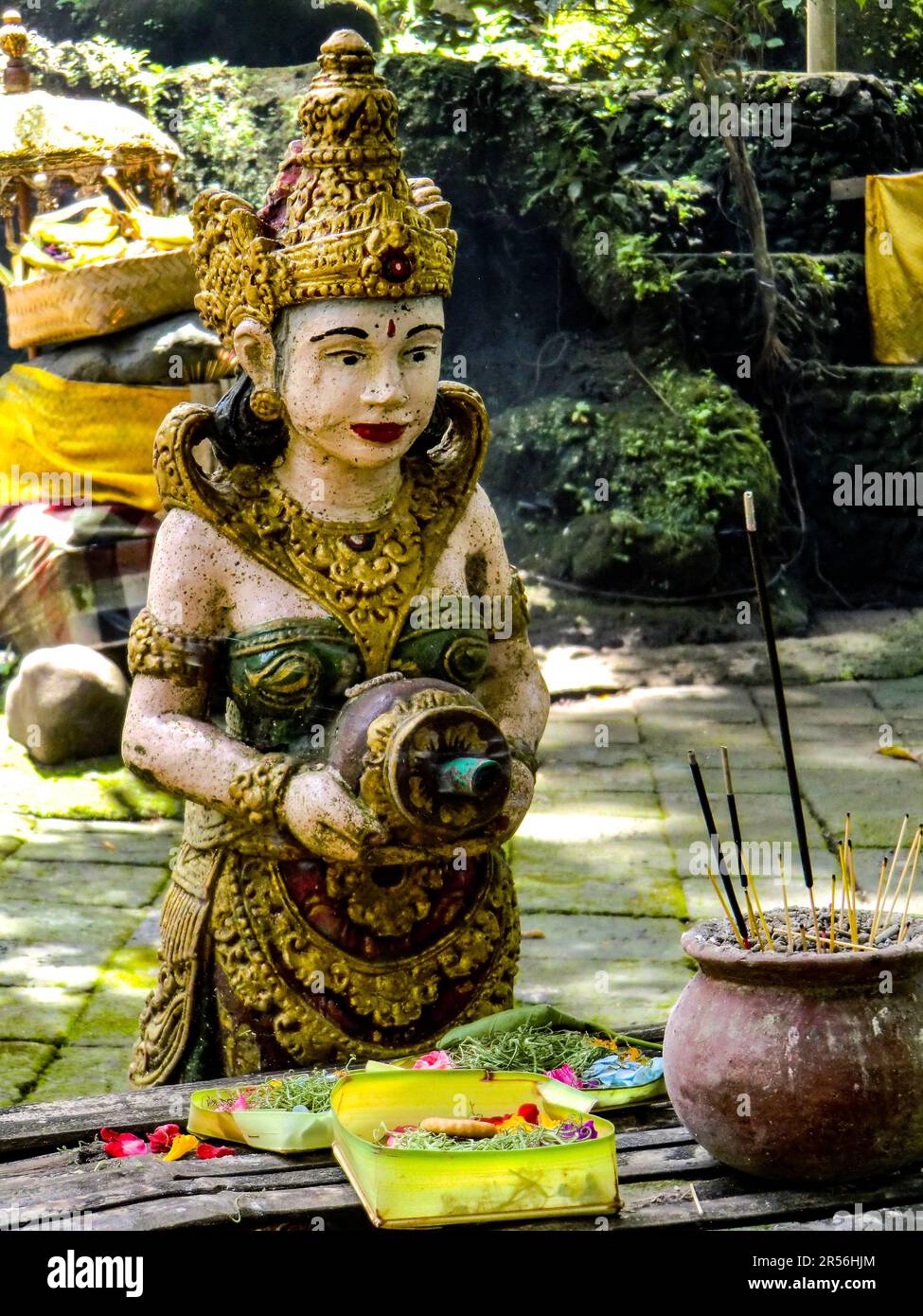 Balinese God statue in temple complex Taman Beji Griya Waterfall