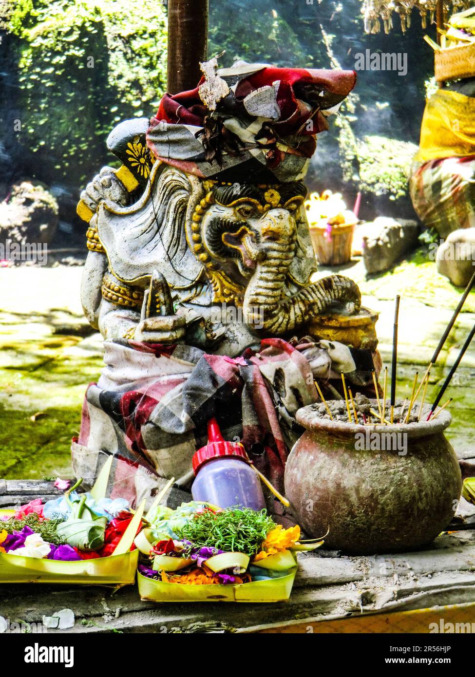 Balinese God statue in temple complex Taman Beji Griya Waterfall