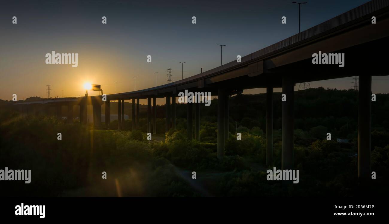 Sunset over the elevated section of the M4 motorway at Port Talbot, South Wales UK Stock Photo