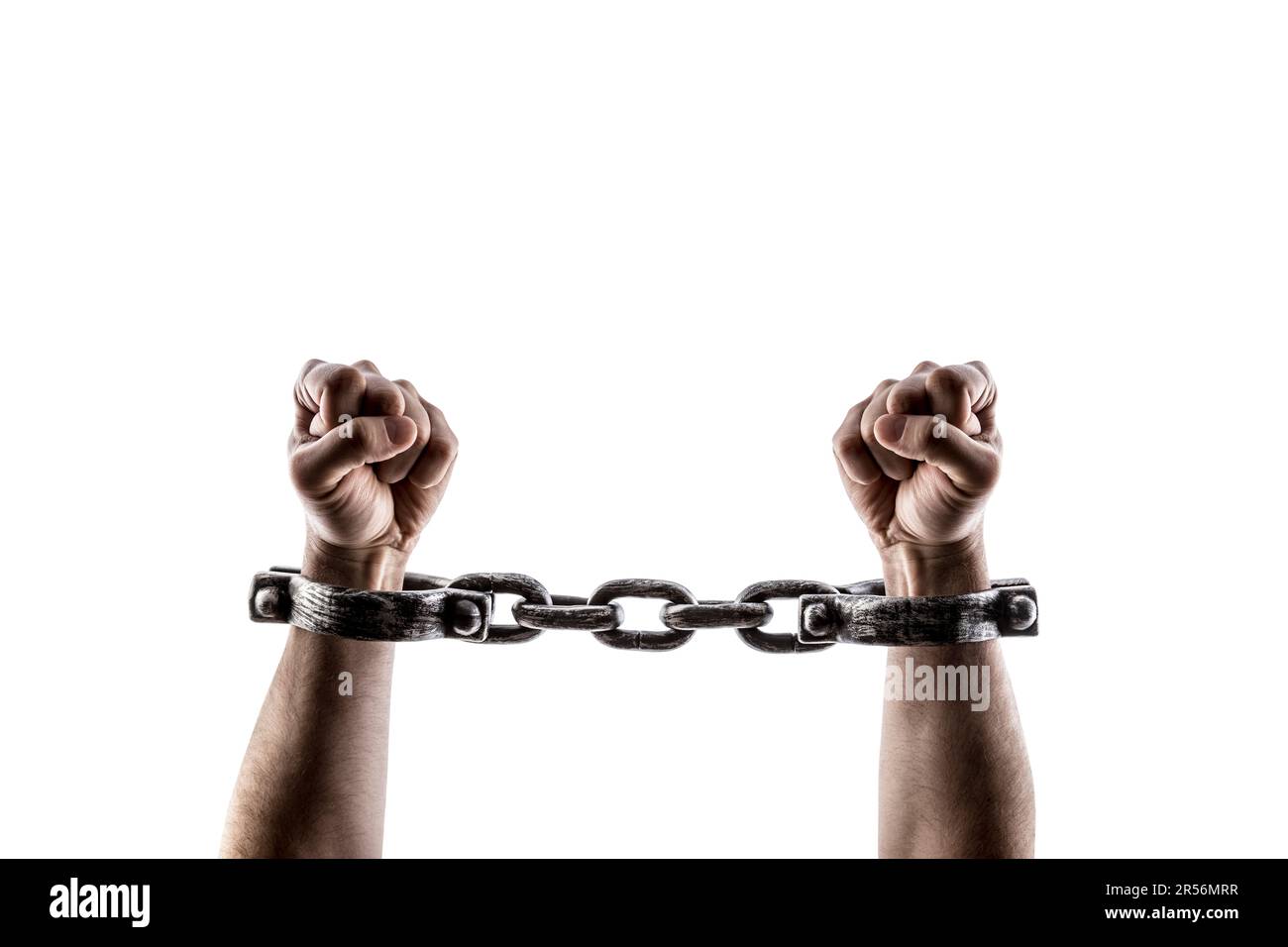 Shackled hands isolated on white background with clipping path Stock Photo