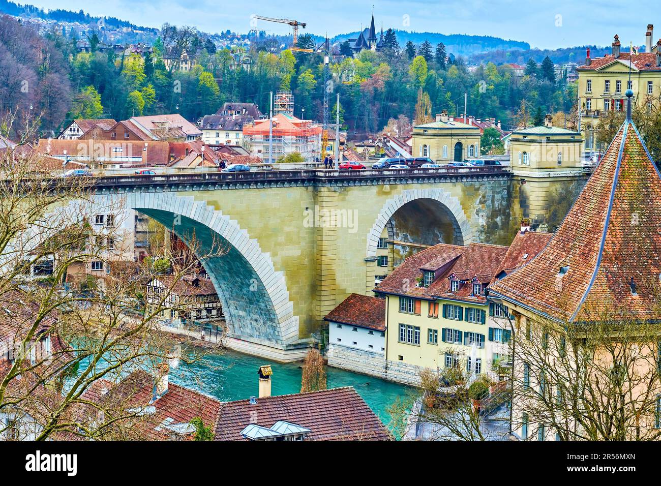 Arched Nydeggbrucke bridge and medival townhouses on the riverside of Aare river in Bern, Switzerland Stock Photo