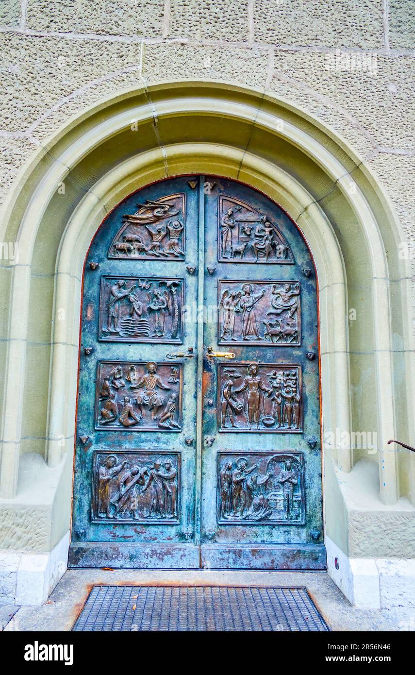 The bronze wrought iron door of Nydeggkirche church with the scenes from the Holy Bible, Bern, Switzerland Stock Photo