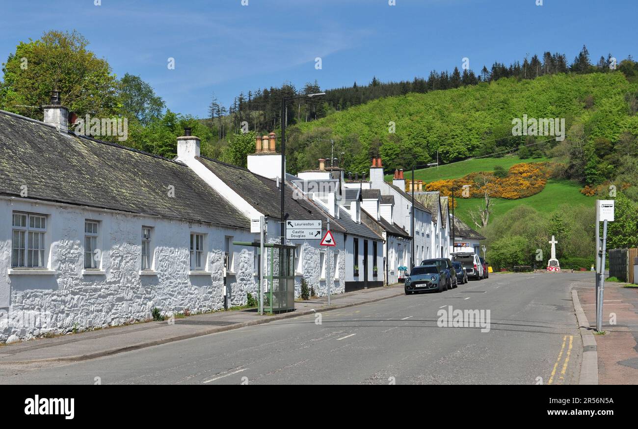 White washed buildings in High Street with war memorial at the end, Gatehouse of Fleet, Dumfries and Galloway, Scotland, UK Stock Photo