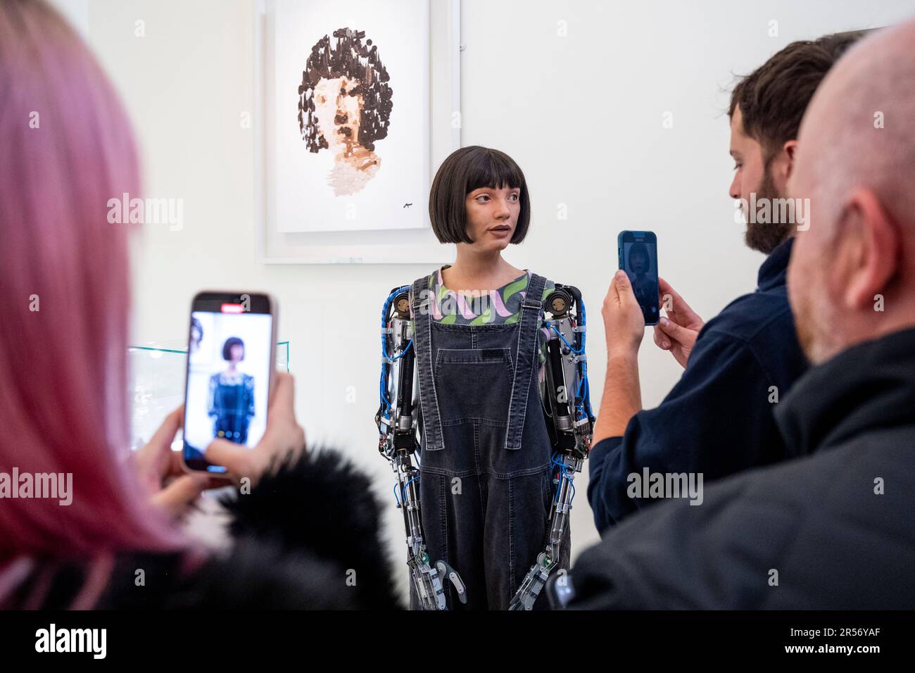 London, UK.  1 June 2023. Visitors interact with Ai-Da robot, the world’s first humanoid robot artist, on the opening day of London Design Biennale 2023 at Somerset House. Using artificial intelligence (AI), she will be designing objects during the festival.  Over 40 international design exhibitors are presenting installations showcasing designs that confront global challenges across a variety of mediums.  The show runs 1 to 25 June.  Credit: Stephen Chung / Alamy Live News Stock Photo