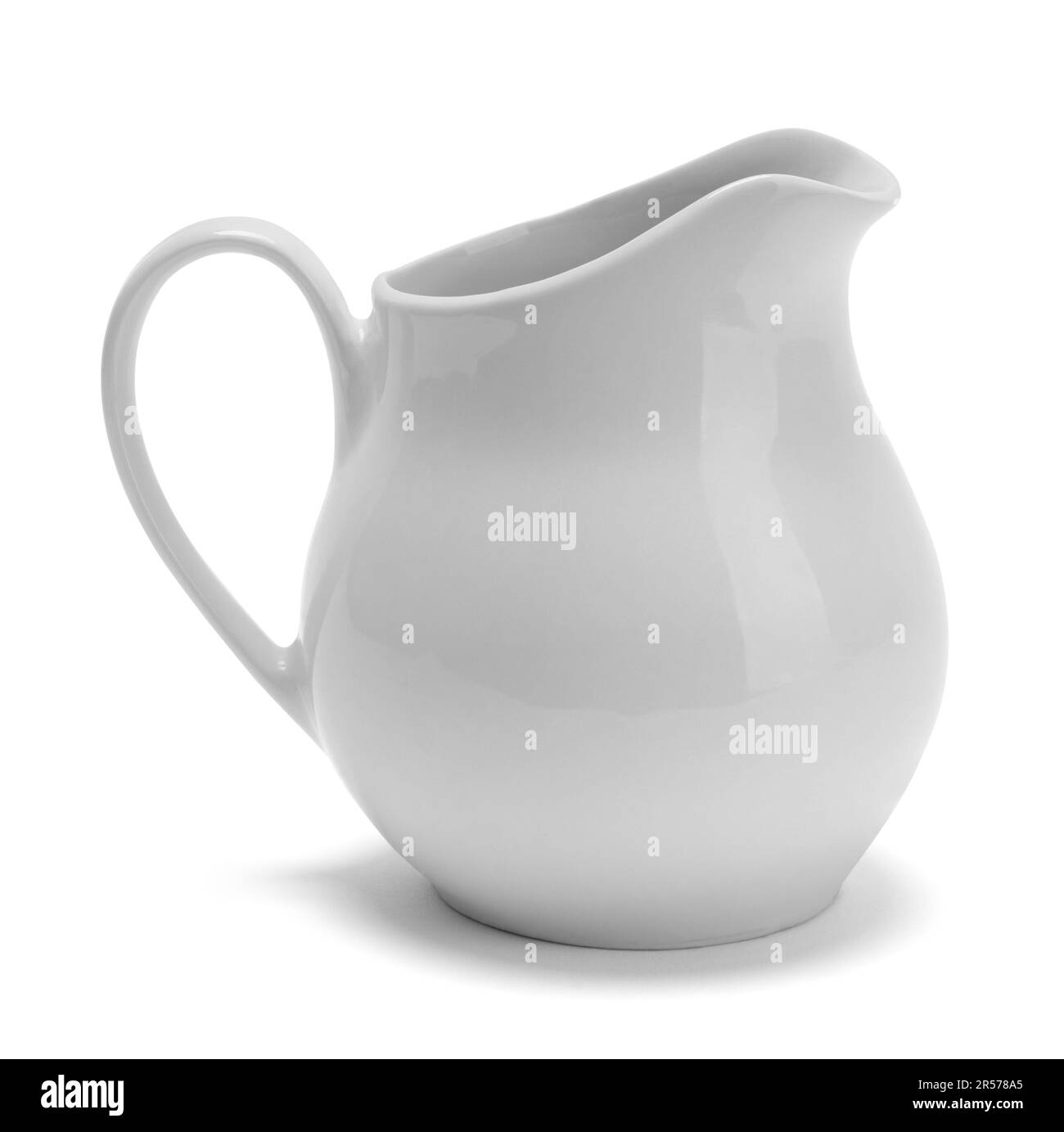 Small Ceramic Pitcher Cut Out on White. Stock Photo