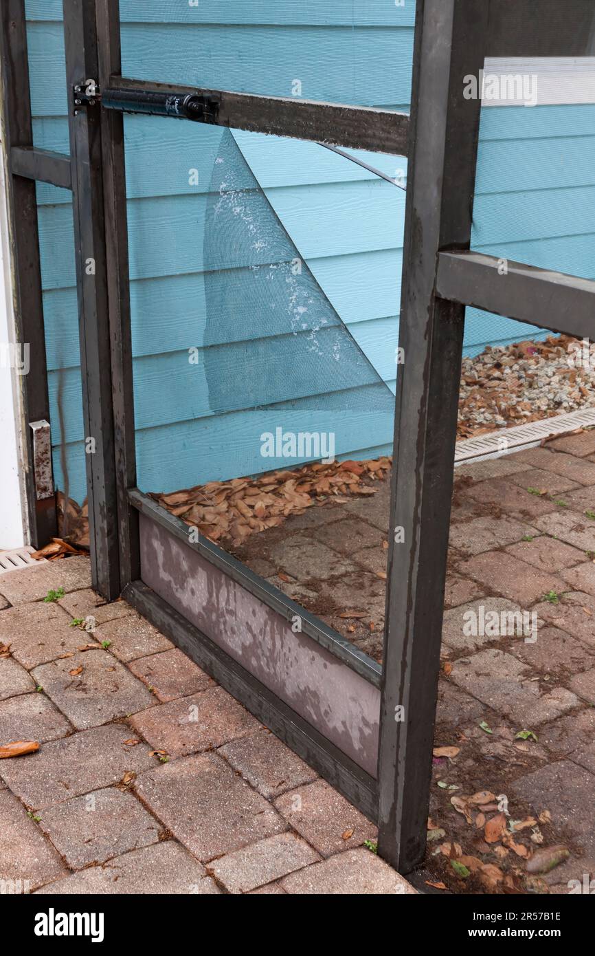 Door's damaged wire screen mesh. Stock Photo