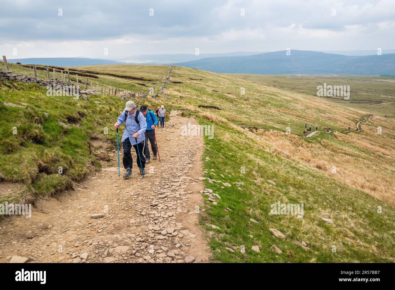 Walkers on the Footpath too Whenside, one of the three peaks in Yorkshire Stock Photo Alamy