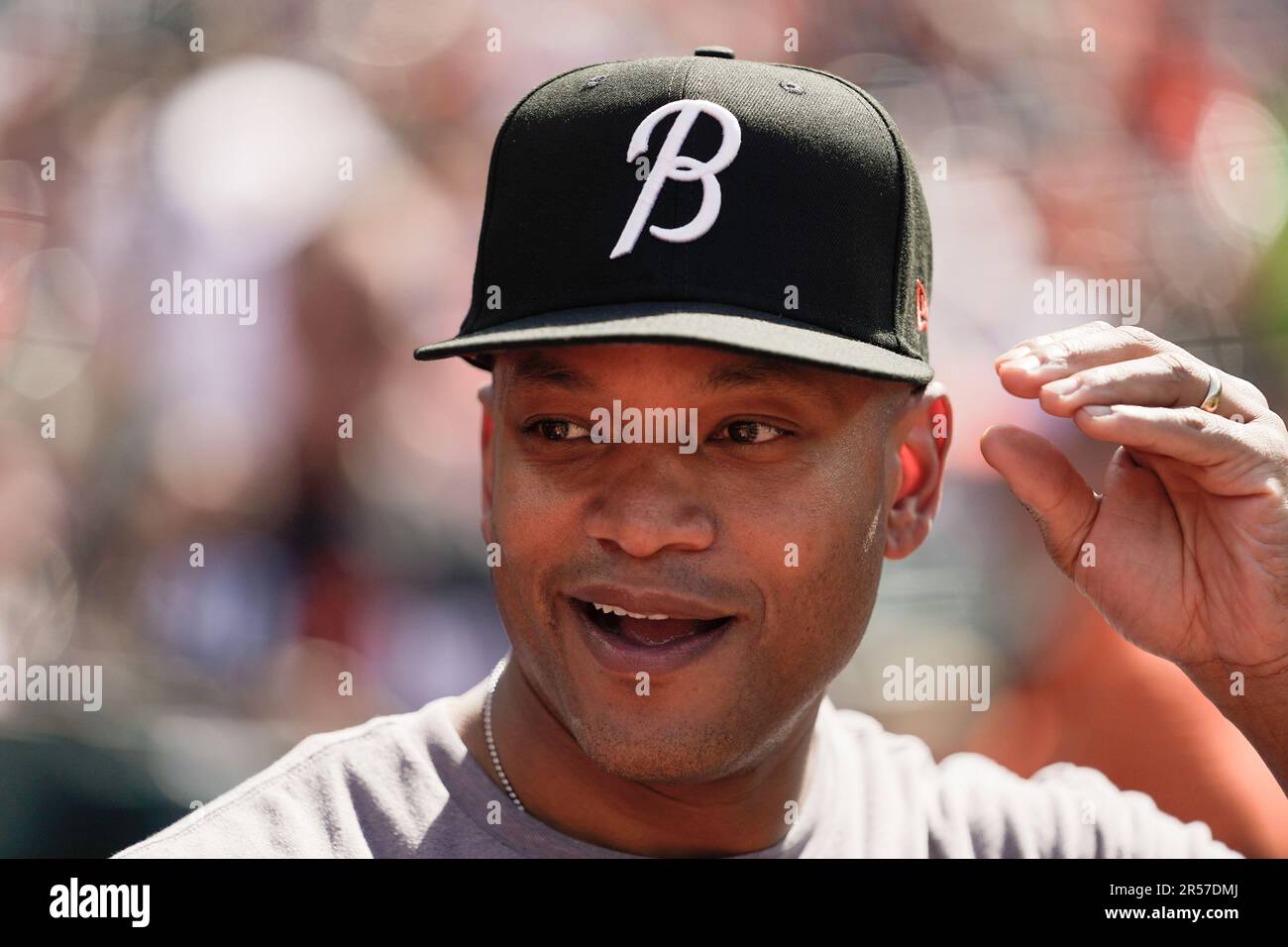 Maryland Gov. Wes Moore dons the Orioles City Connect hat prior to a  baseball game between the Baltimore Orioles and the Texas Rangers,  Saturday, May 27, 2023, in Baltimore. (AP Photo/Julio Cortez