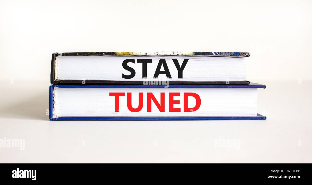 Stay tuned symbol. Concept words Stay tuned on beautiful books on a