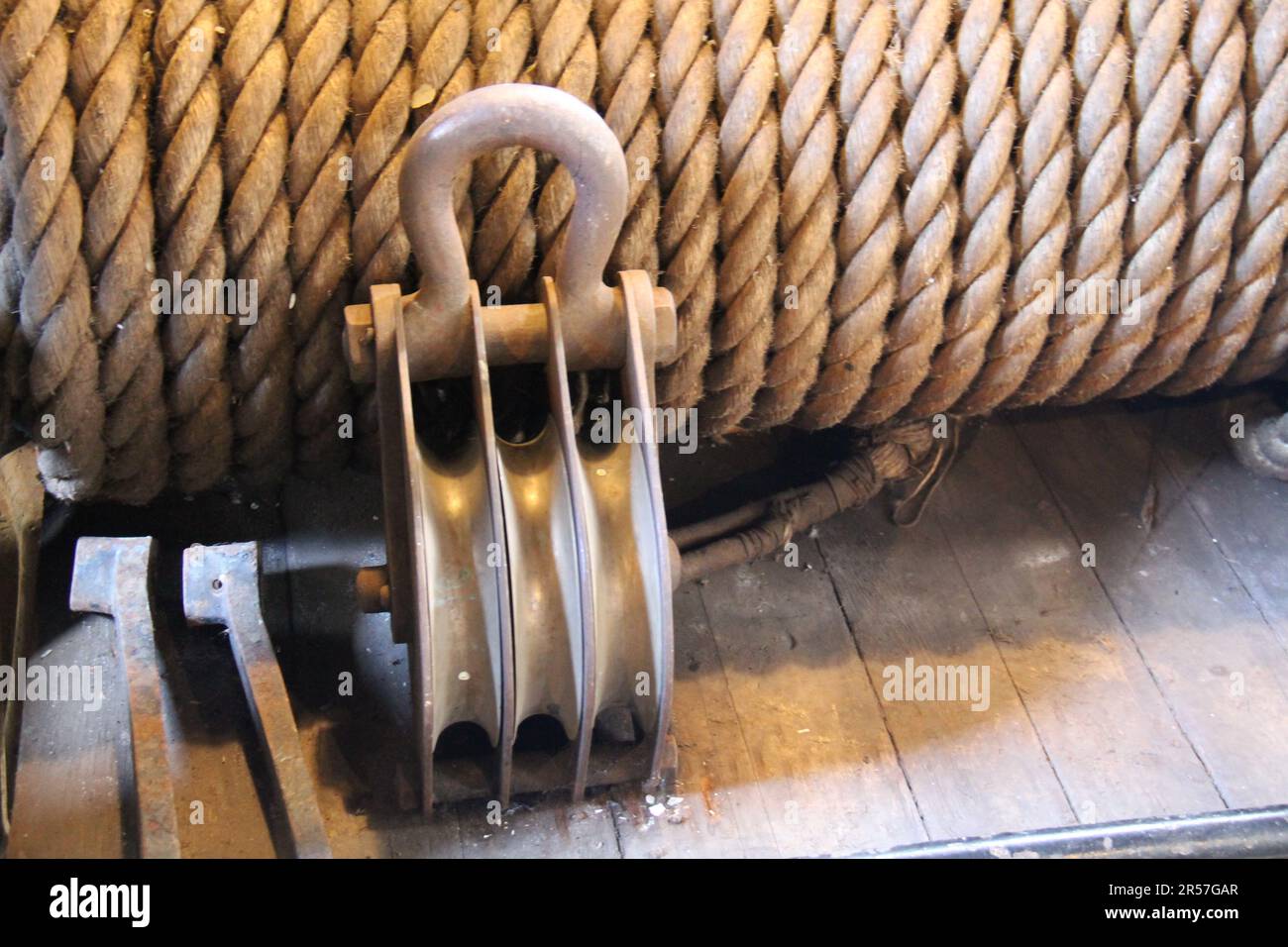 A Heavy Duty Rope Pulley in an Industrial Setting. Stock Photo