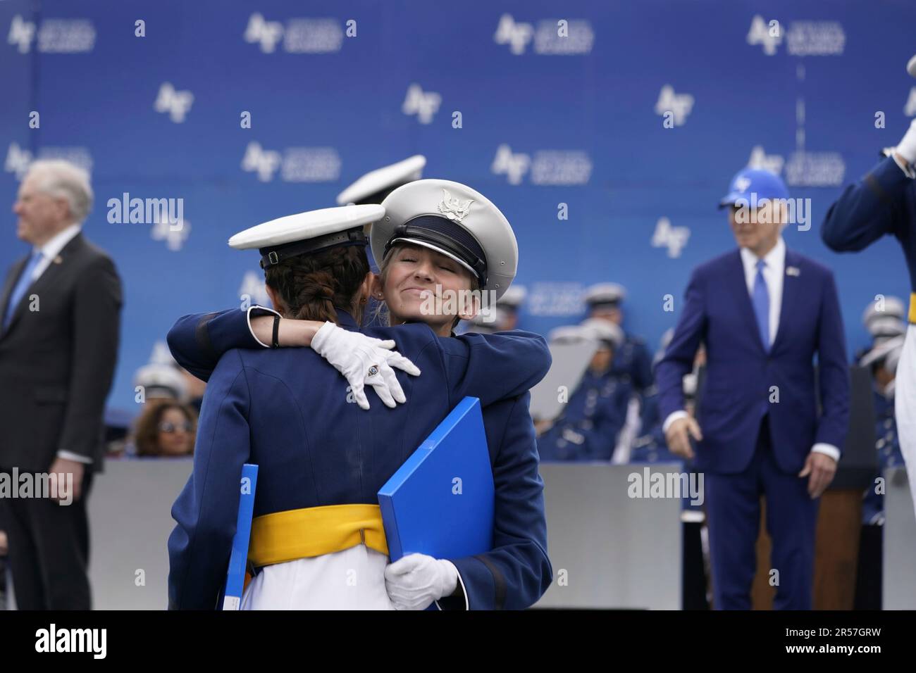 Cadets celebrate after receiving a their diploma from President Joe