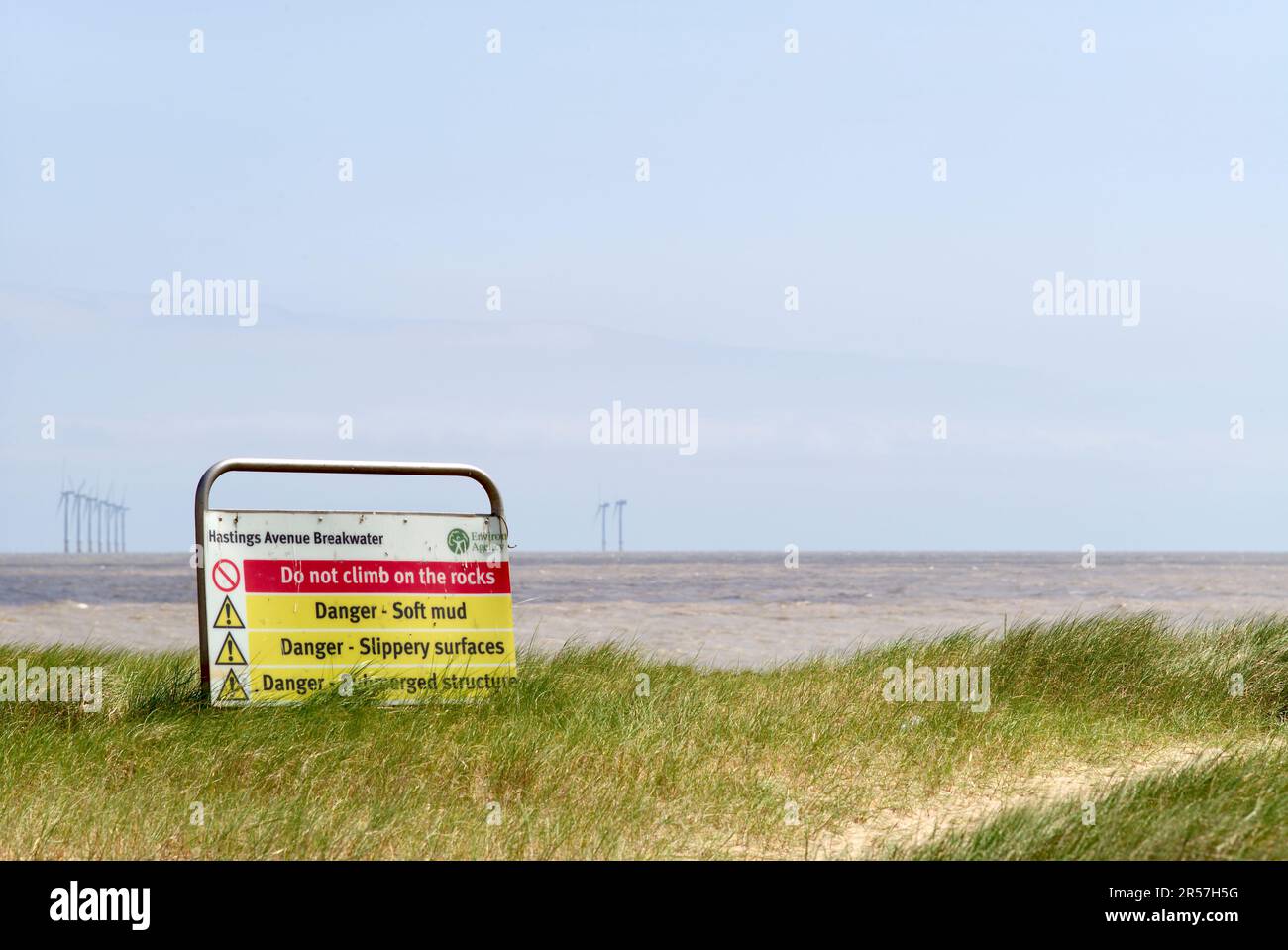 Warning sign Martello Bay Clacton on Sea Stock Photo