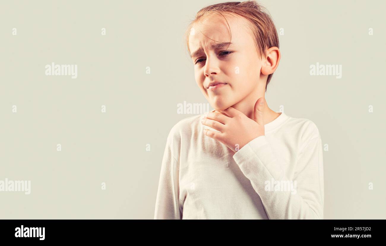 Sore throats in a child. Child has a sore throats. Signs of a cold in children. Young boy feels