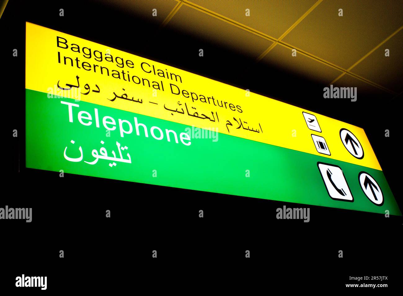 Baggage claim and telephone sign in an international airport in Middle