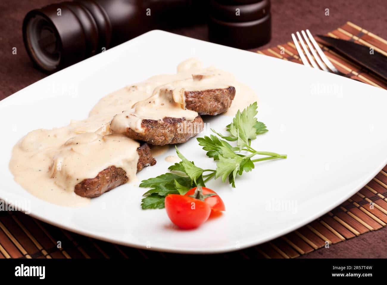 Roasted meat under white sauce Stock Photo Alamy