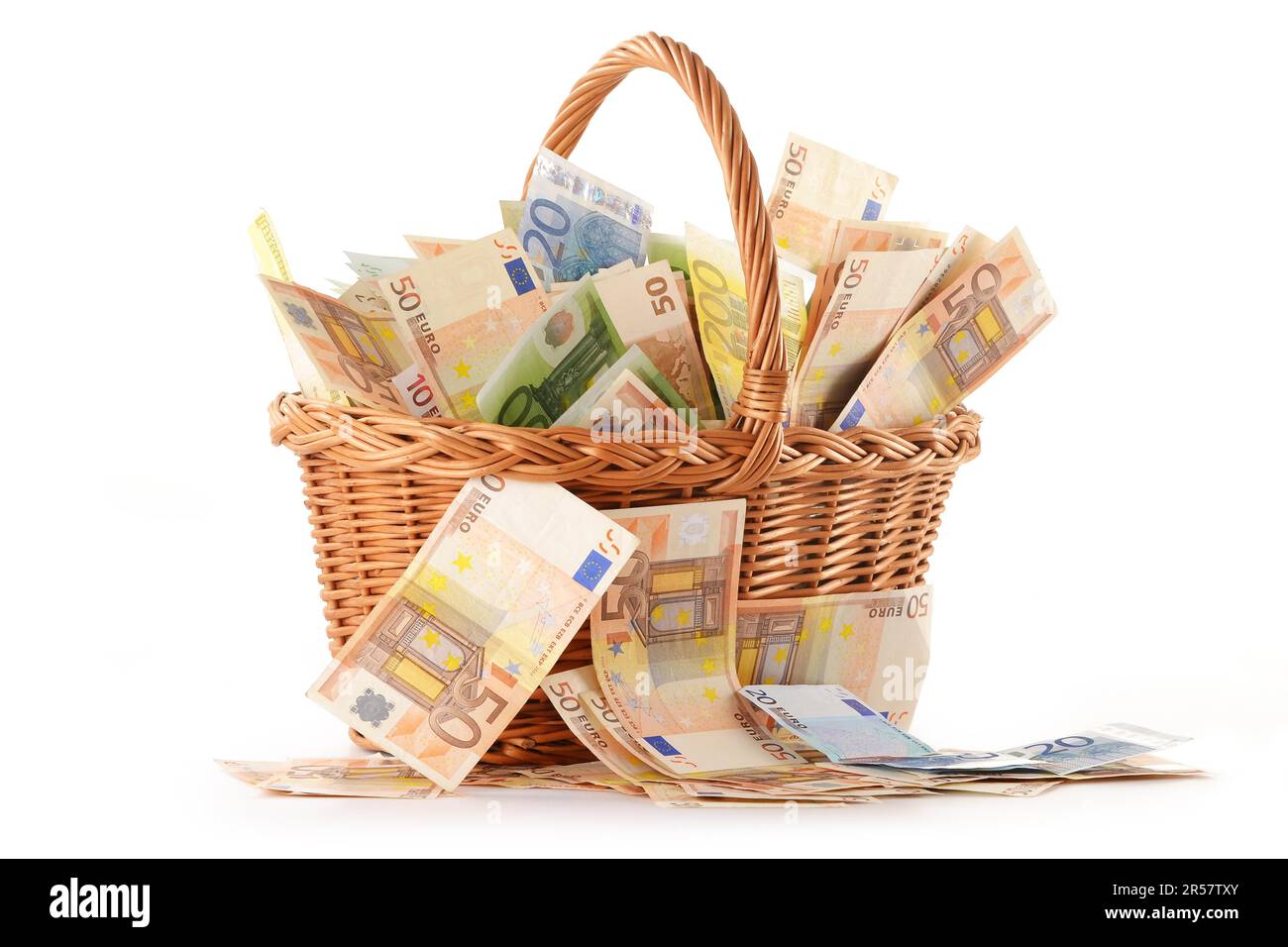 Composition with Euro banknotes in wicker basket. European Union currency Stock Photo