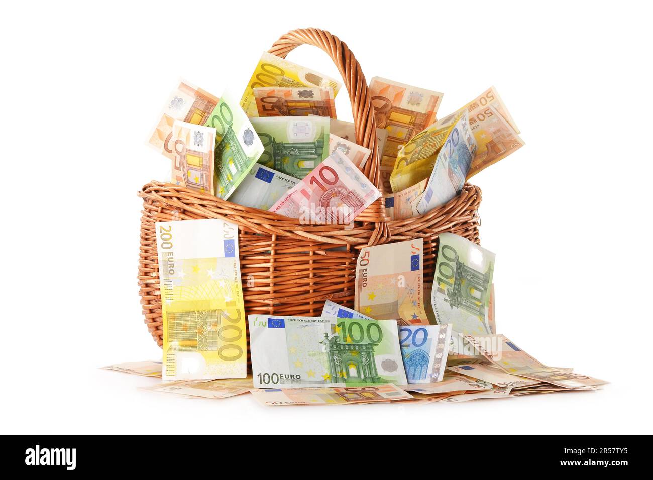 Composition with Euro banknotes in wicker basket. European Union currency Stock Photo