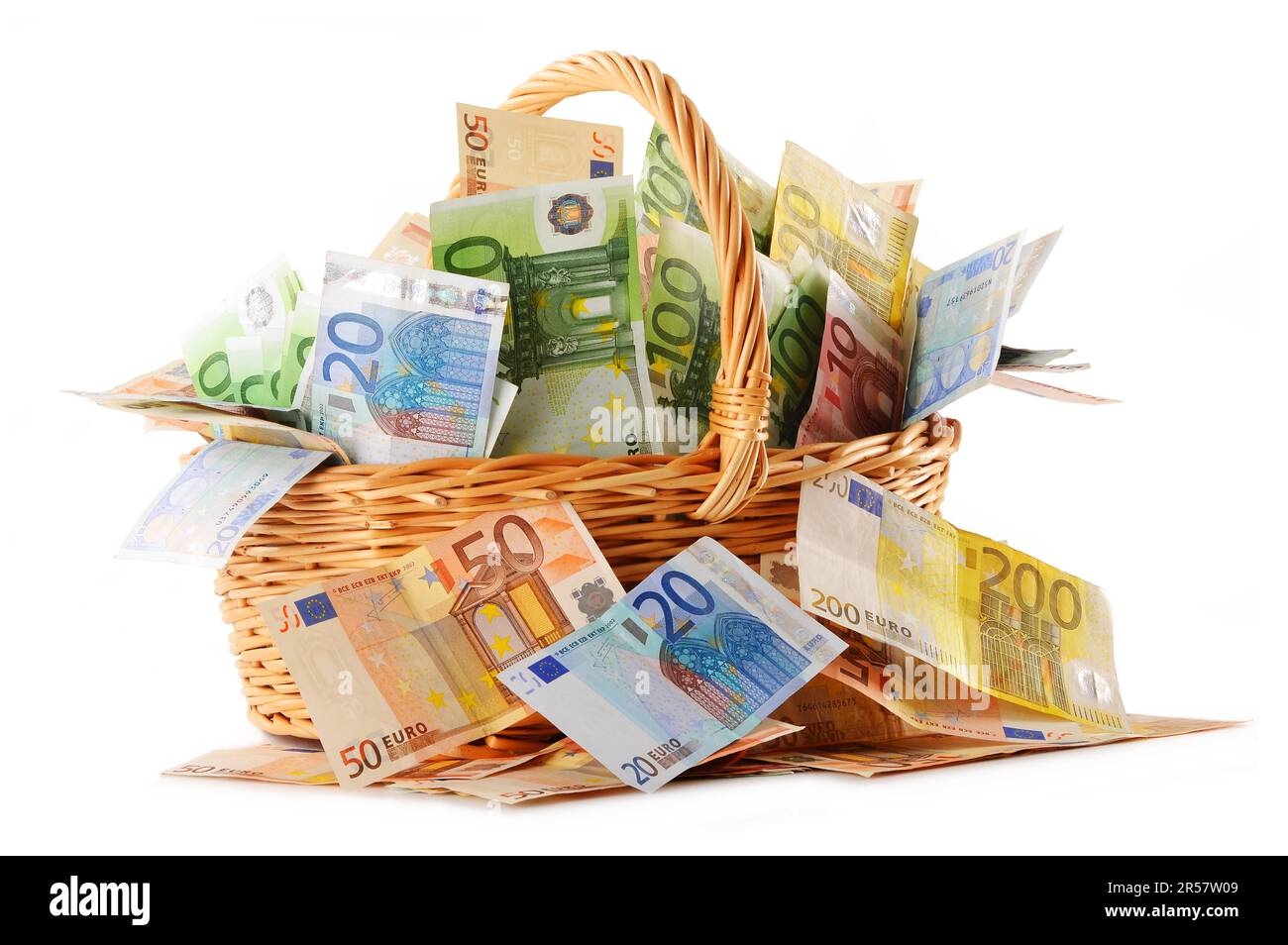 Composition with Euro banknotes in wicker basket. European Union currency Stock Photo