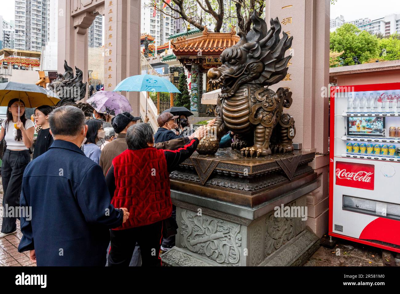Chinese People Touching Statues For Good Luck At The Wong Tai Sin