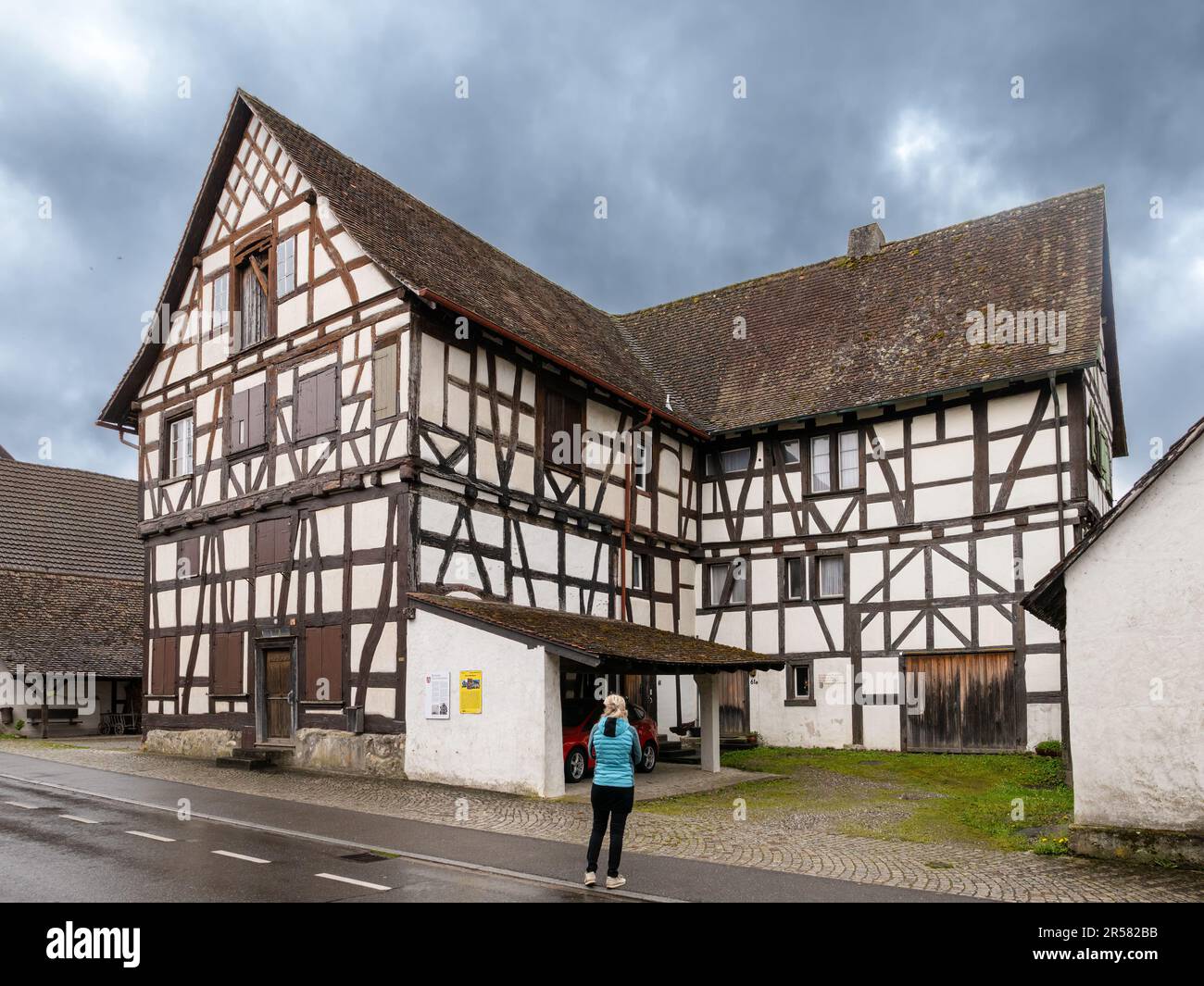 Busingen, Germany - May 1, 2023: The imposing half-timbered Junkerhaus in the middle of the village was once the seat of the noble landlords of Busing Stock Photo