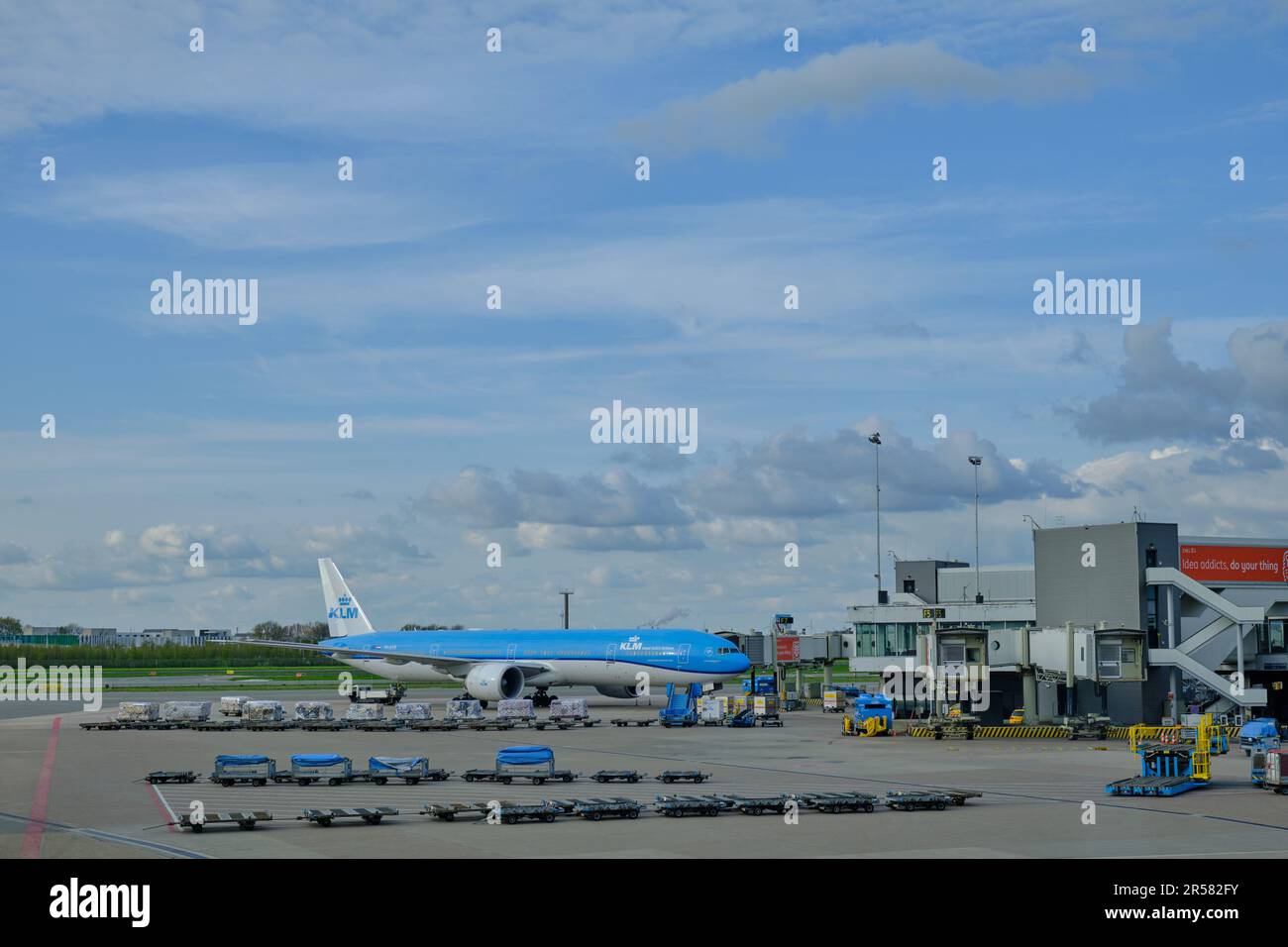 Amsterdam Schiphol Airport, North Holland, The Netherlands -  April 26 2023. A Boeing 777-200 airplane from KLM Royal Dutch Airlines parked at gate F5 Stock Photo