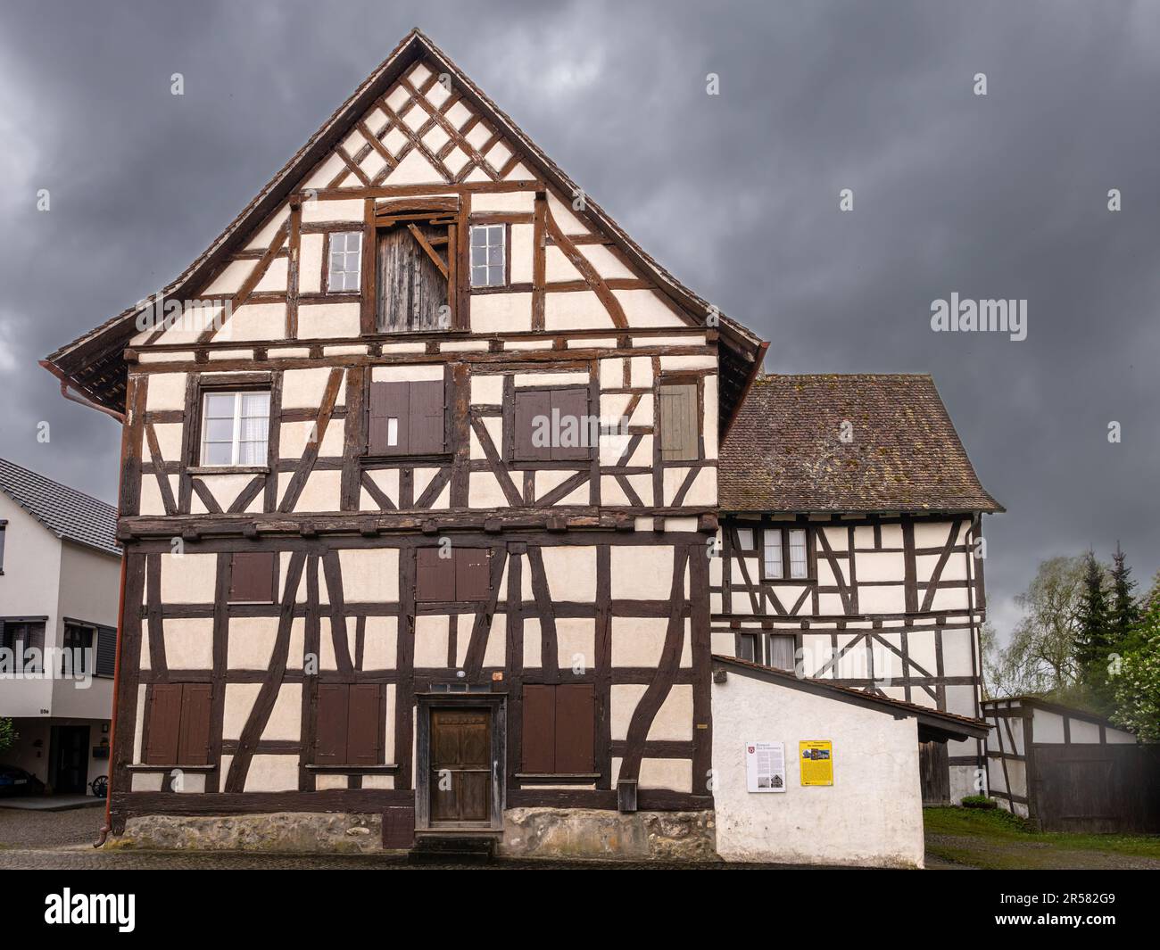 Busingen, Germany - May 1, 2023: The imposing half-timbered Junkerhaus in the middle of the village was once the seat of the noble landlords of Busing Stock Photo