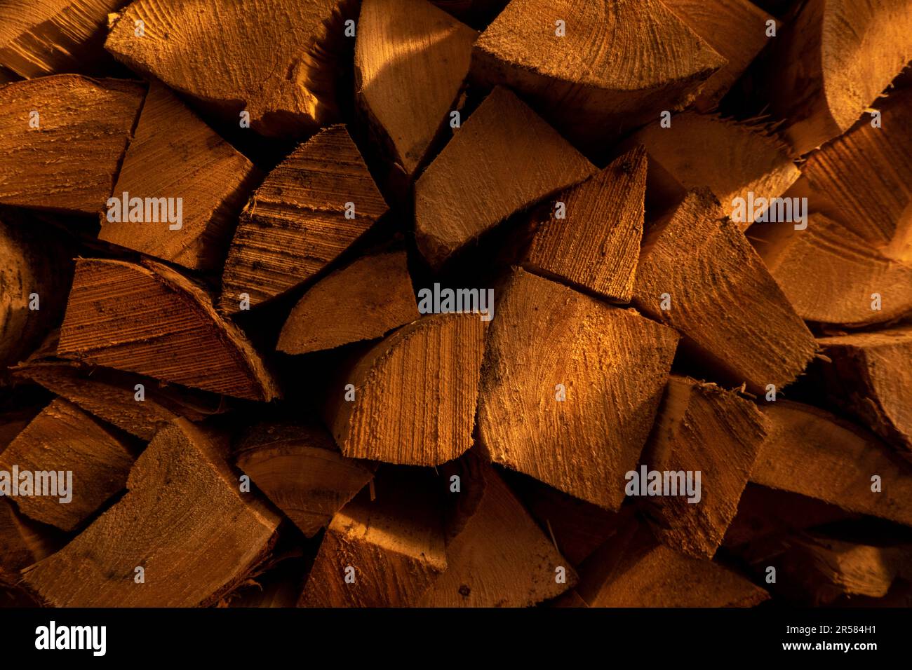 Log spruce trunks pile. Sawn trees from the forest. Logging timber wood ...