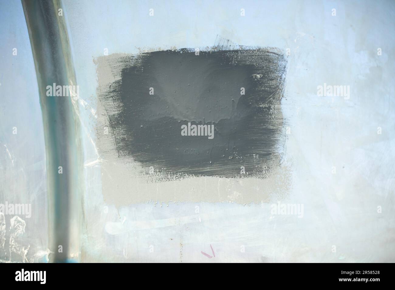 Painted inscription on wall. Vandalism in city. Paint stain. Texture of ...