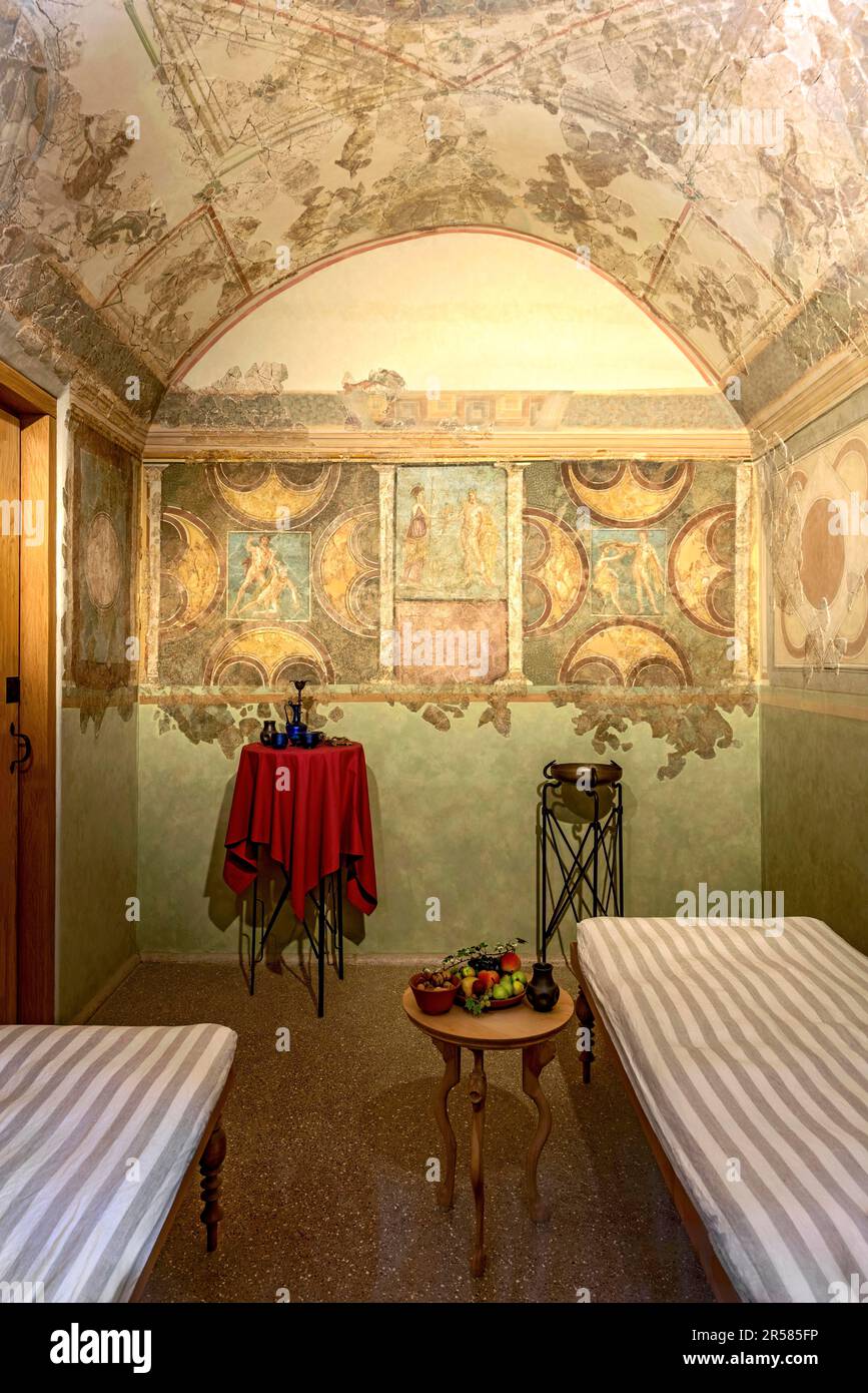 Dining room with couches of an officer, frescoes, wall paintings in the Echzell triclinium, Roman fort Saalburg, reconstructed cohort fort, museum Stock Photo