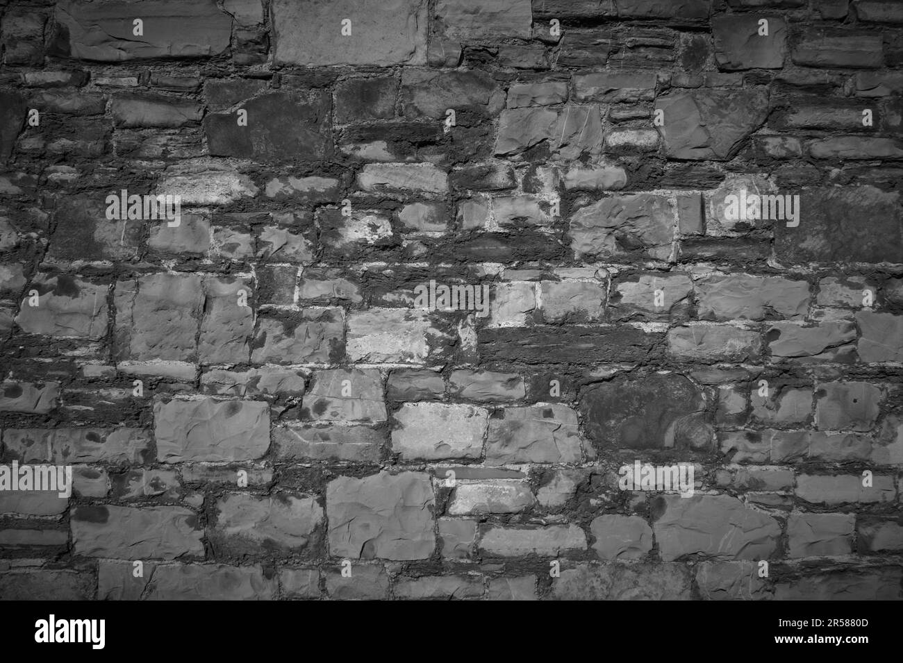Decorative wall made of natural stones. Black and white background Stock Photo Alamy