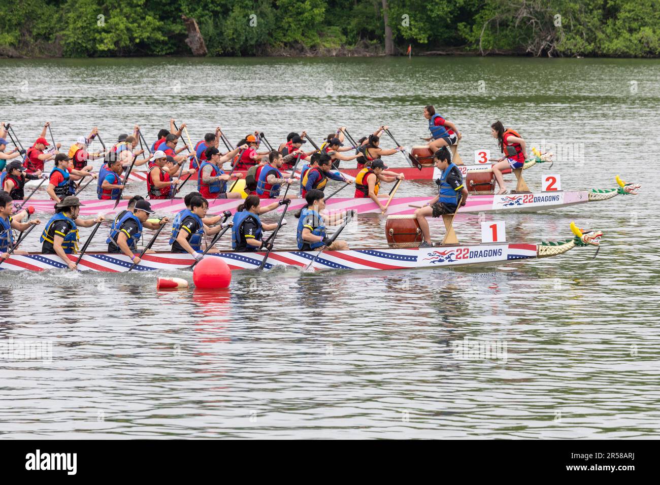 Washington, DC - The start of a 200 meter race during DC Dragon Boat Festival on the Potomac River. Dragon boating is a 2300-year-old Chinese traditio Stock Photo