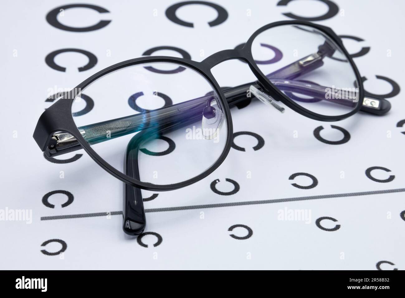 Eyeglasses on the eye chart checking vision concept, eyesight test Stock Photo