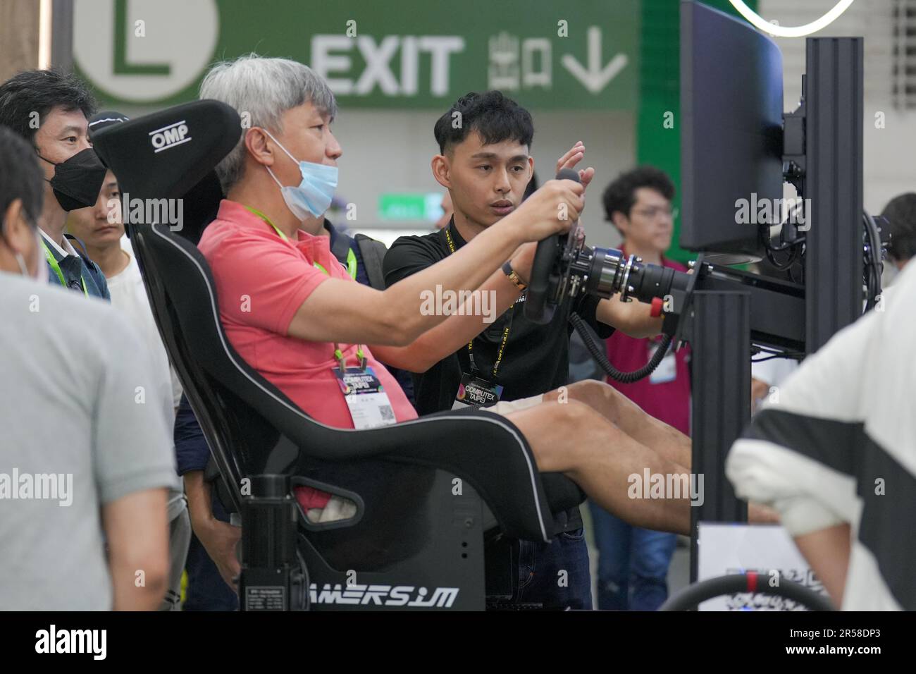 Taipei, Taiwan. 01st June, 2023. A person using a computer steering wheel at PNY booth at COMPUTEX 2023 in Taipei. The 2023 edition of COMPUTEX runs from 30 May to 02 June 2023 and gathers over 1,000 exhibitors from 26 different countries with 3000 booths to display their latest products and to sign orders with foreign buyers. (Photo by Walid Berrazeg/SOPA Images/Sipa USA) Credit: Sipa USA/Alamy Live News Stock Photo