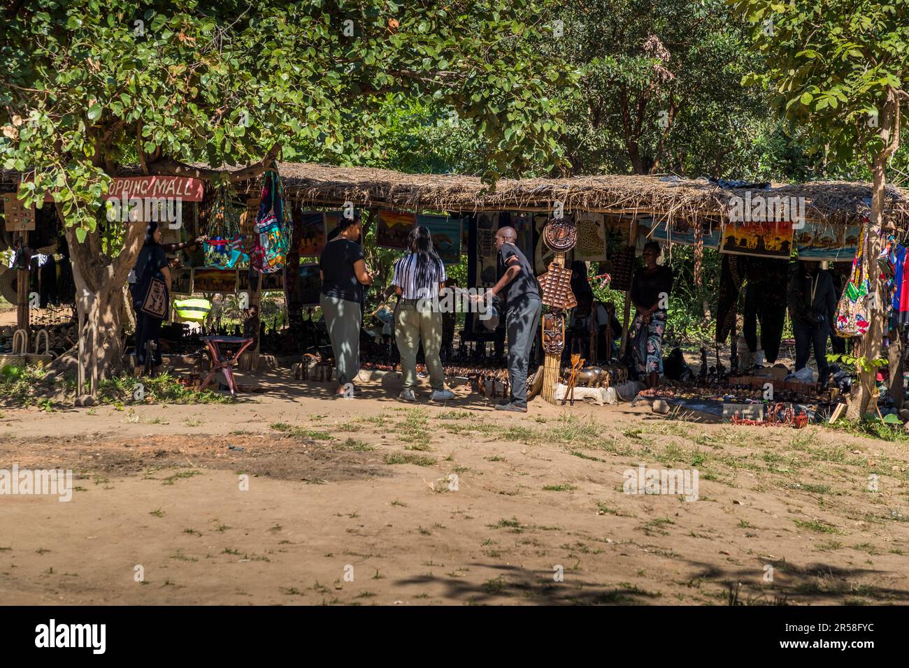 Shopping Mall at Kutchire Lodge. Residents from the surrounding villages have a permanent sales booth for souvenirs here. Guests at Kutchire Lodge (Malawi), can also join a guided walk into the neighboring village. During the conversation, one learns about the influence of the Liwonde National Park, which was established two decades ago, on the structures that have grown for generations. Stock Photo