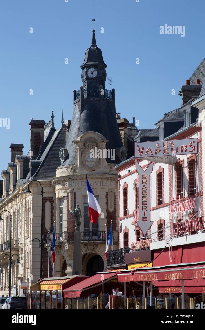 The town hall - Hotel de Ville - cafes and restaurants lining the bank of the  Touques River Trouville-sur-Mer Normandy France Stock Photo