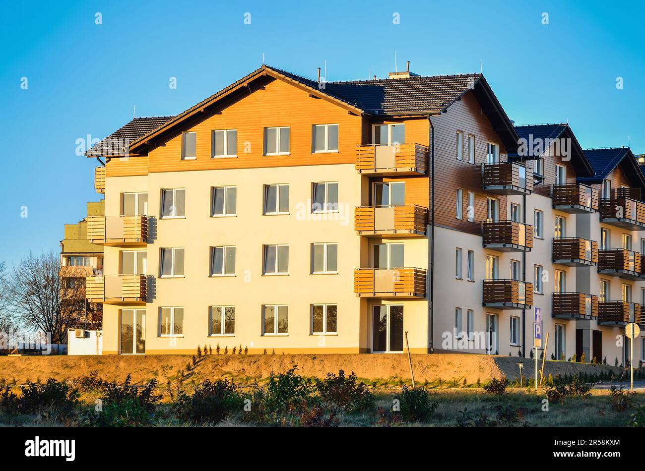Tychy, Poland - November 8, 2015: New housing estates in Tychy City, Poland. Public view of newly built block of flats in the green area. Stock Photo
