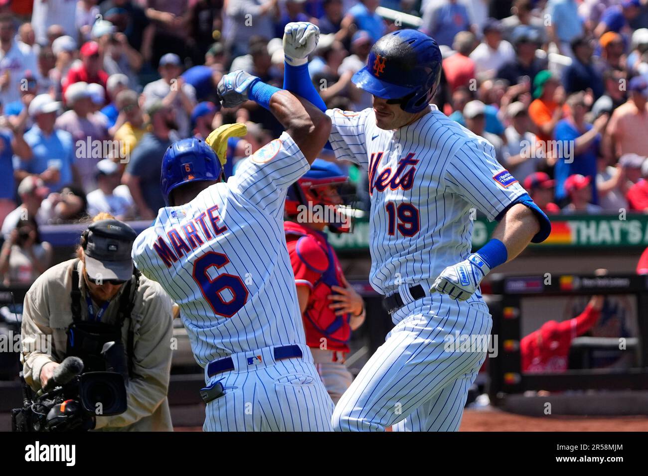 FLUSHING, NY - JUNE 01: New York Mets Right Fielder Starling Marte (6) arms  bumps New York Mets Left Fielder Mark Canha (19) to congratulate him for  hitting a home run during