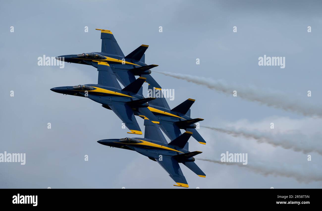 Four U.S. Navy F/A-18E Super Hornets from the Blue Angels fly in a diamond formation above Scott Air Force Base, Illinois, May 12, 2023. The Blue Angels are the premiere demonstration team of the Navy and fly in formations such as these, sometimes a few feet from each other, to showcase their expert and precision flying skills to entertain the masses. (U.S. Air Force photo by Staff Sgt. Solomon Cook) Stock Photo