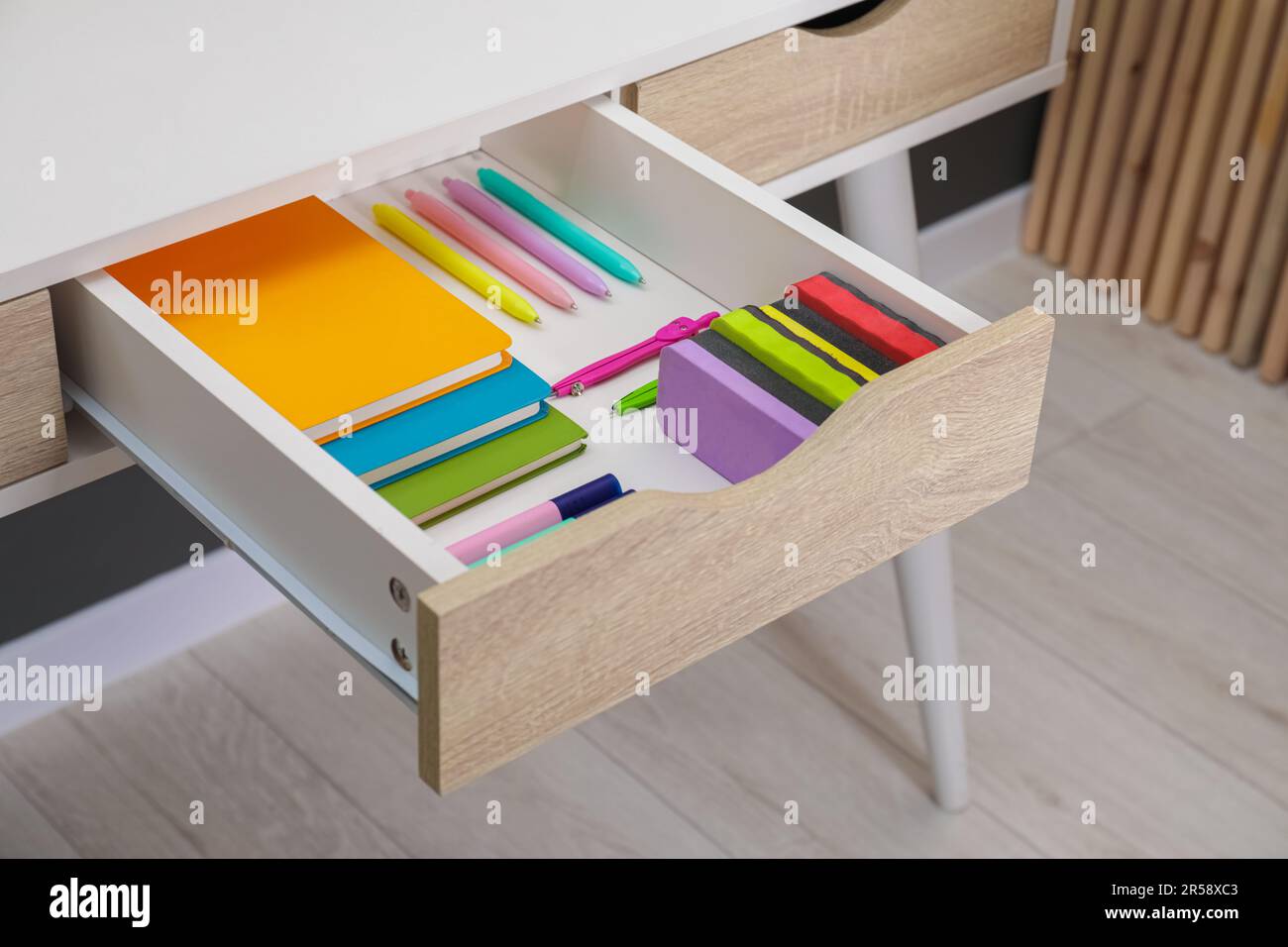 Office supplies in open desk drawer indoors Stock Photo Alamy
