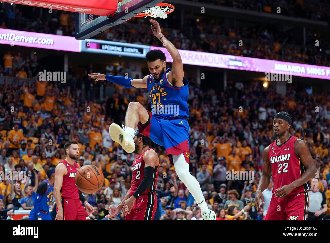 Denver Nuggets guard Jamal Murray, center, dunks against the Miami Heat
