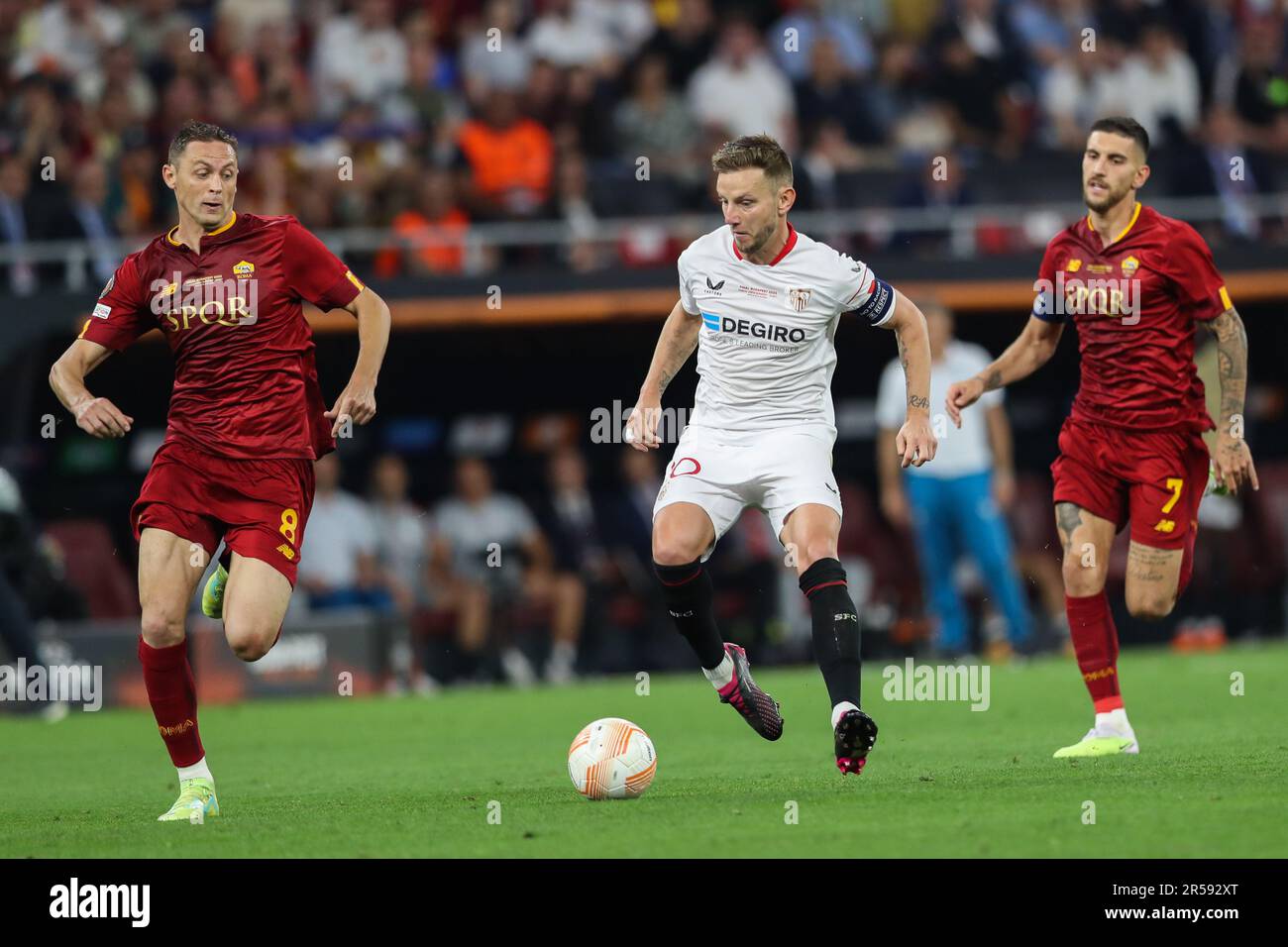 Budapest, Hungary. 31st May, 2023. Ivan Rakitic of Sevilla (C), Nemanja Matic (L) and Lorenzo Pellegrini of AS Roma (R) in action during the UEFA Europa League 2023 Final match between Sevilla and AS Roma at Puskas Arena. Final score; Sevilla 1:1 AS Roma (penalties 4:1). Credit: SOPA Images Limited/Alamy Live News Stock Photo