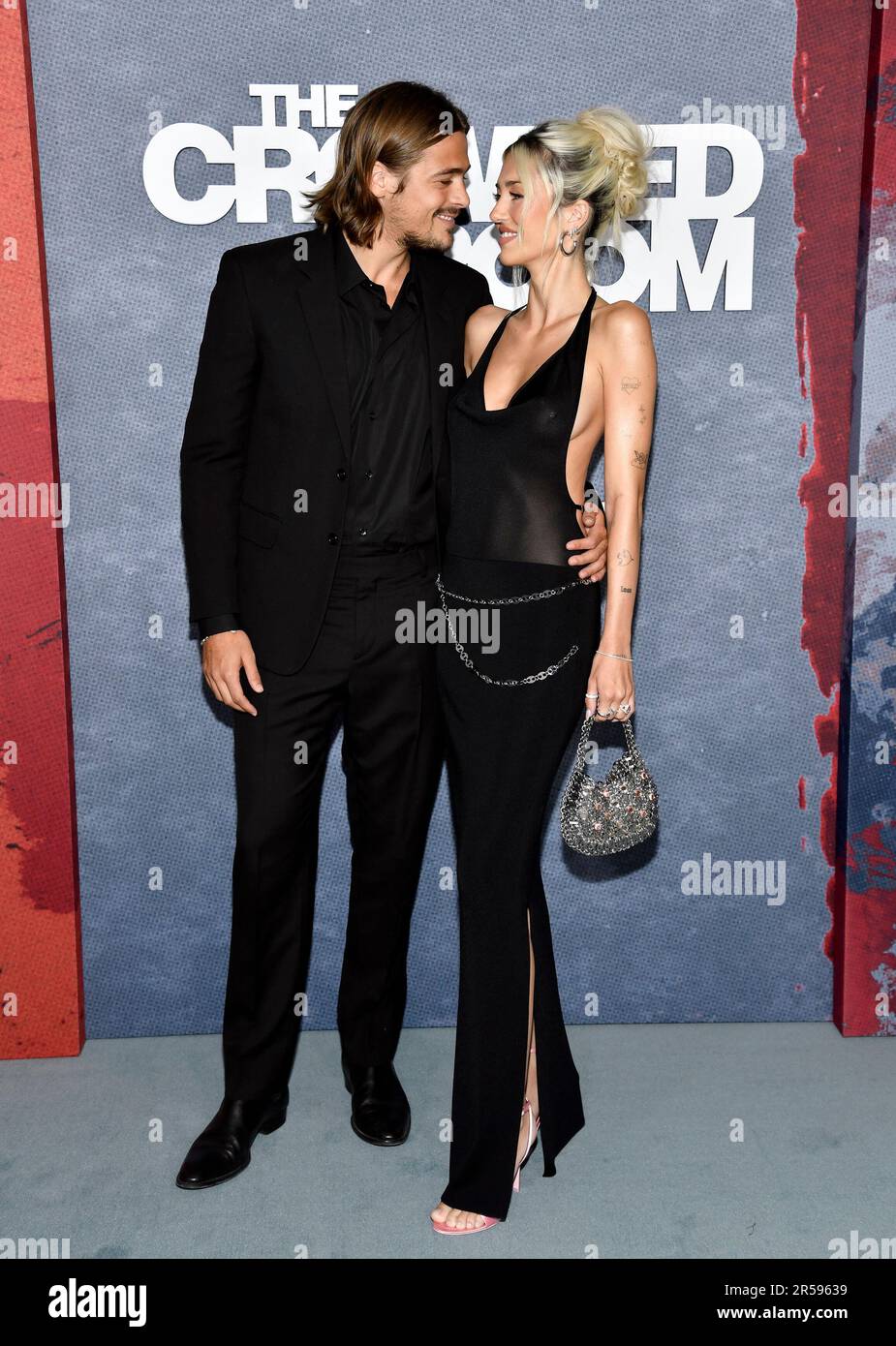 Henry Eikenberry, left, and girlfriend Delilah Hamlin attend the Apple