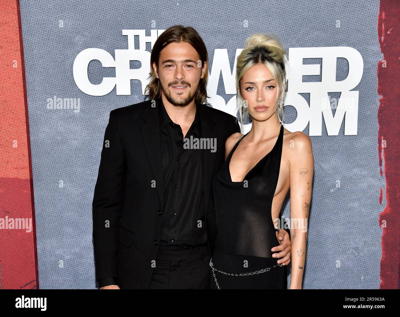 Henry Eikenberry, left, and girlfriend Delilah Hamlin attend the Apple