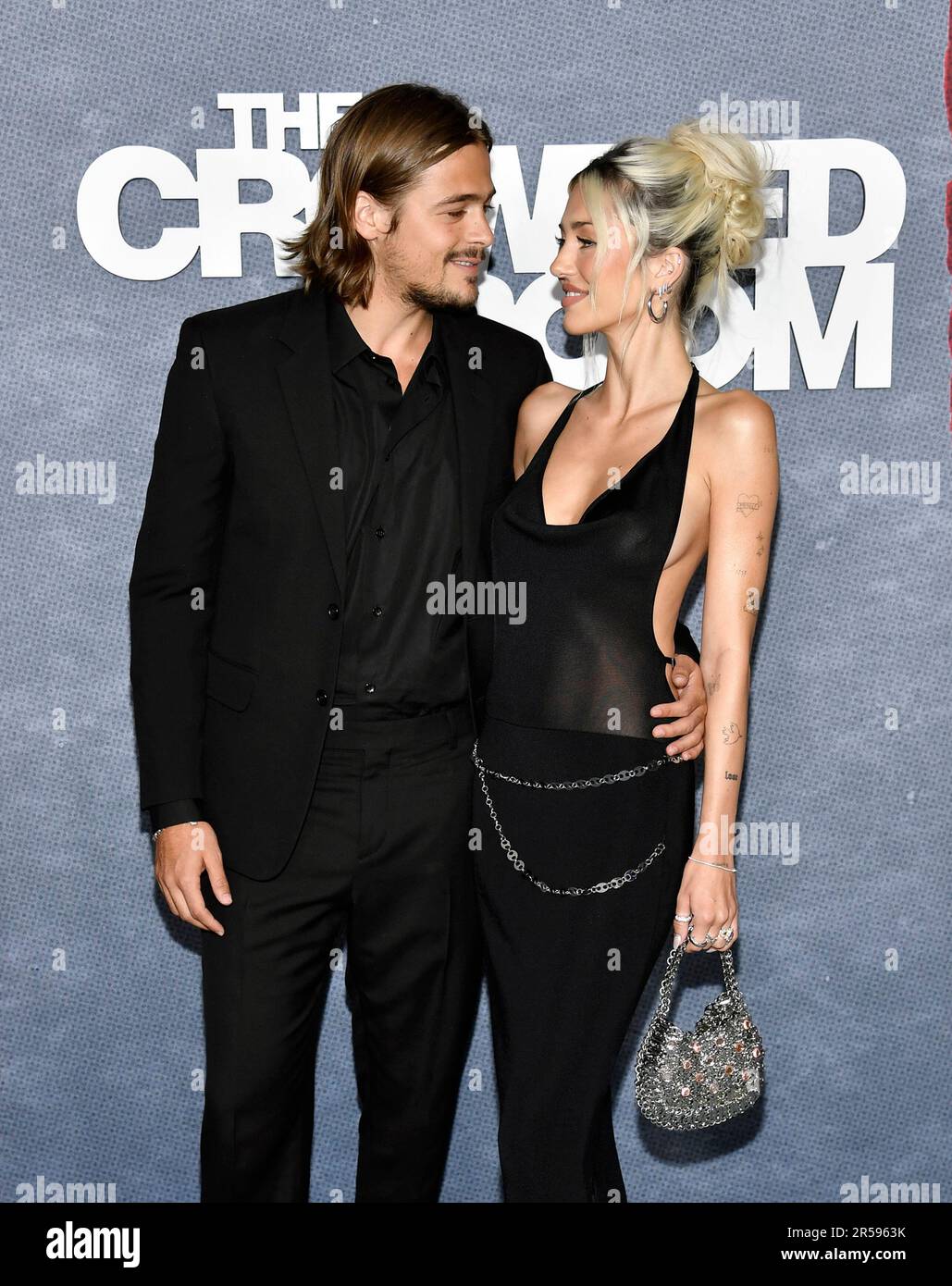 Henry Eikenberry, left, and girlfriend Delilah Hamlin attend the Apple