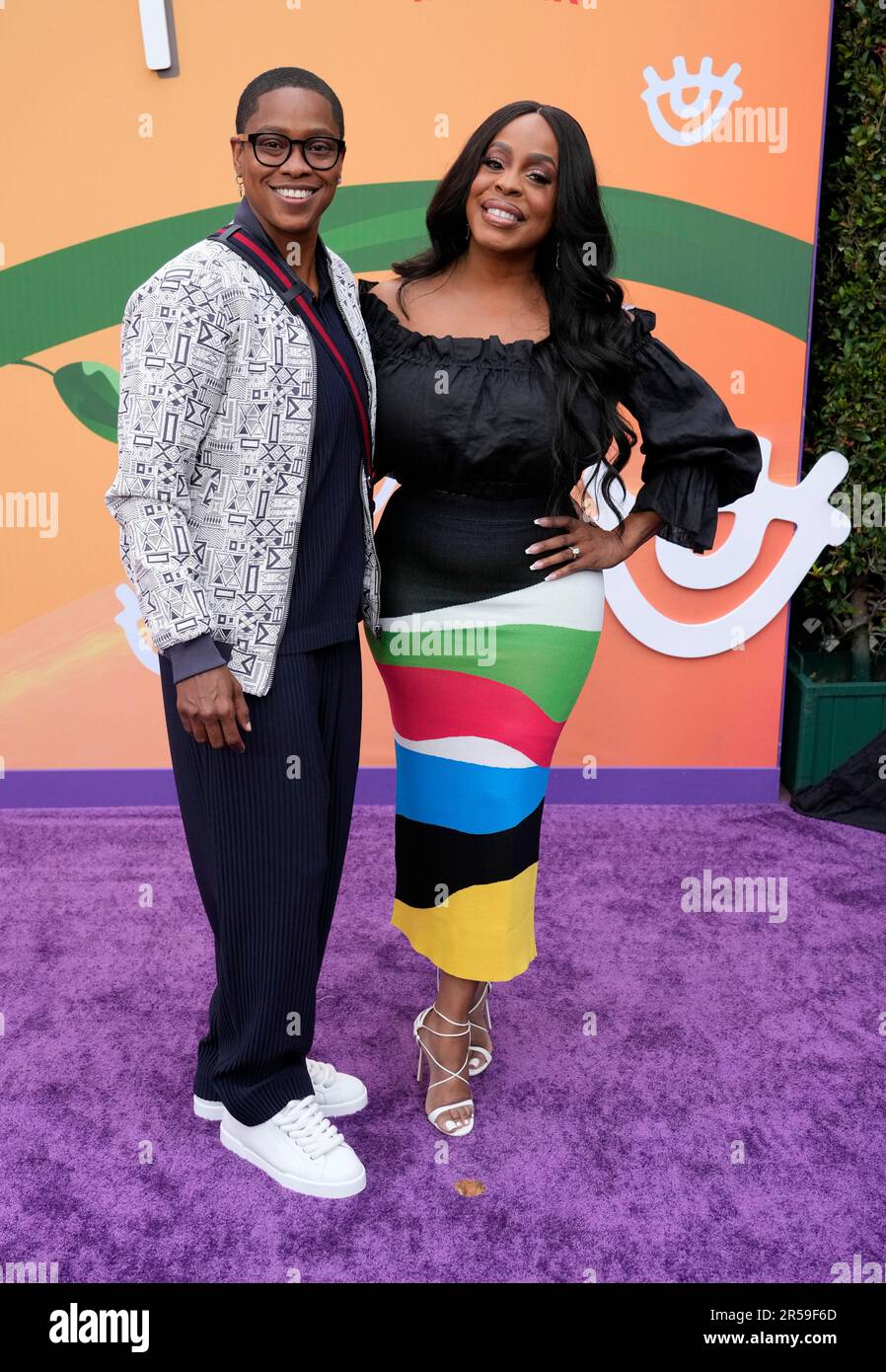 Niecy NashBetts, right, and her wife Jessica Betts pose together at