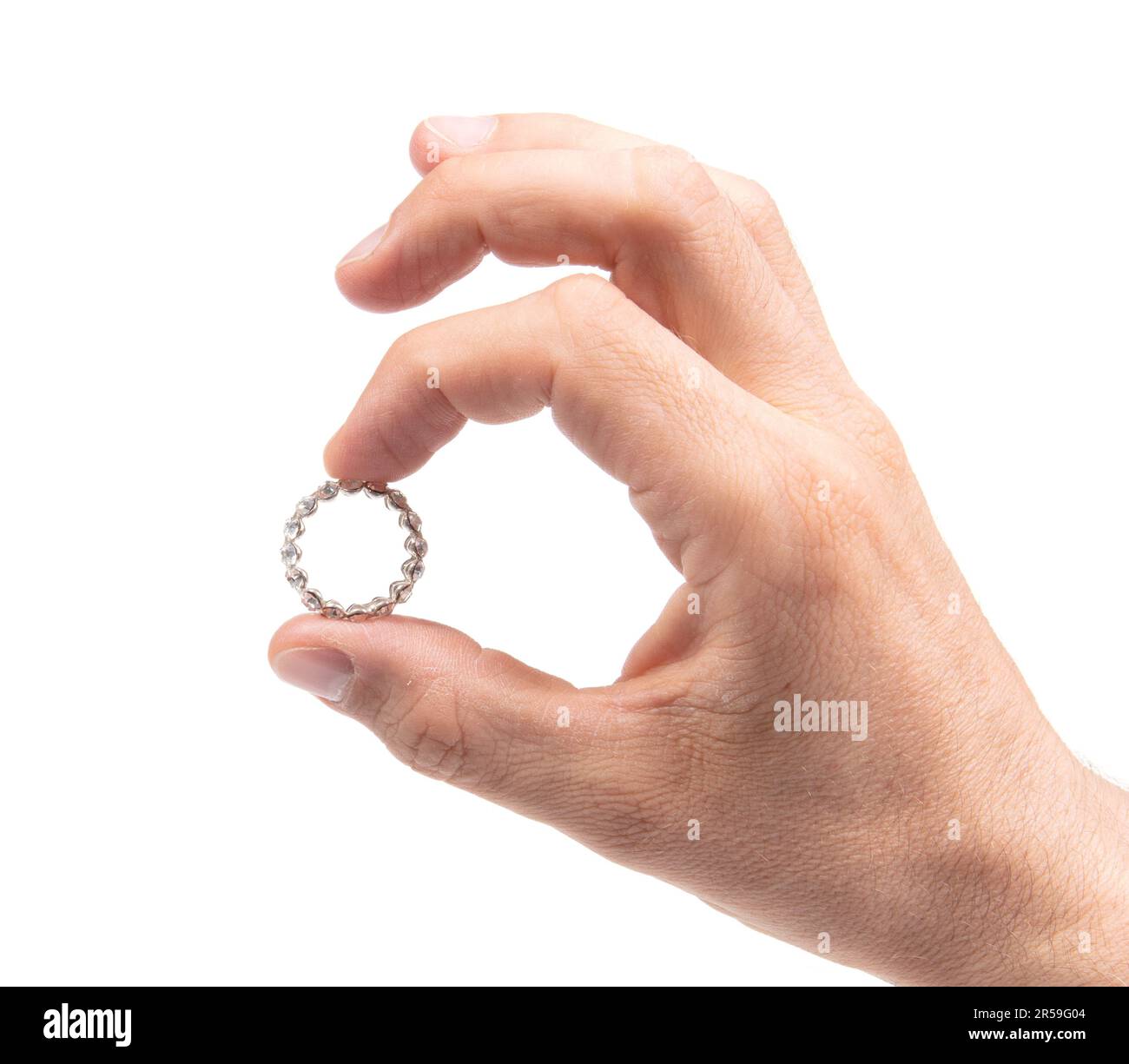 Large diamond ring on the hand on a male adult, isolated Stock Photo