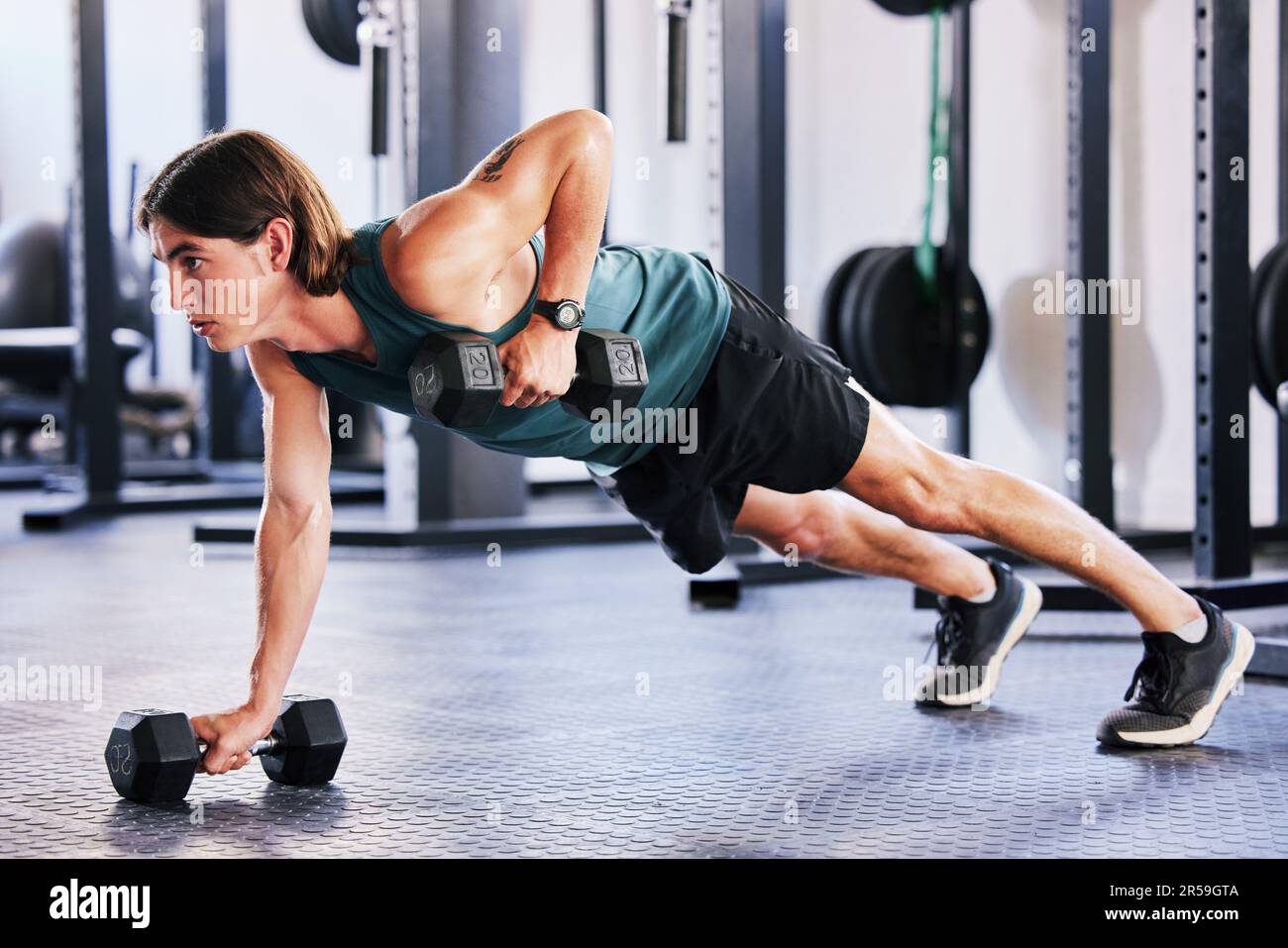 Fitness dumbbell and push up with a man at gym for a workout biceps exercise or training. Male athlete person with iron weights for strong muscle Stock Photo Alamy