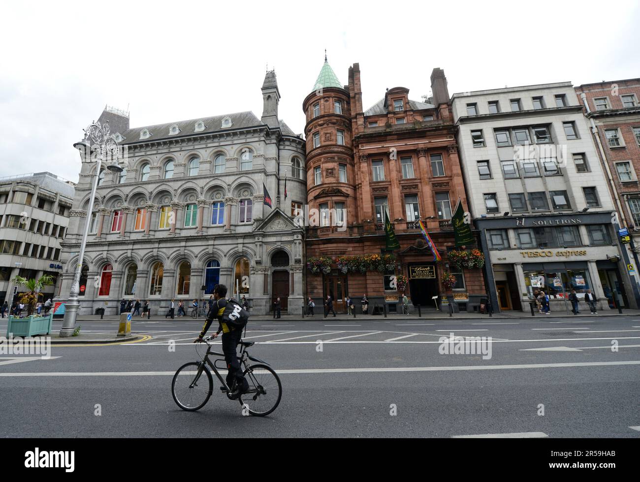 Walking along the busy Dame street in Dublin, Ireland. Stock Photo