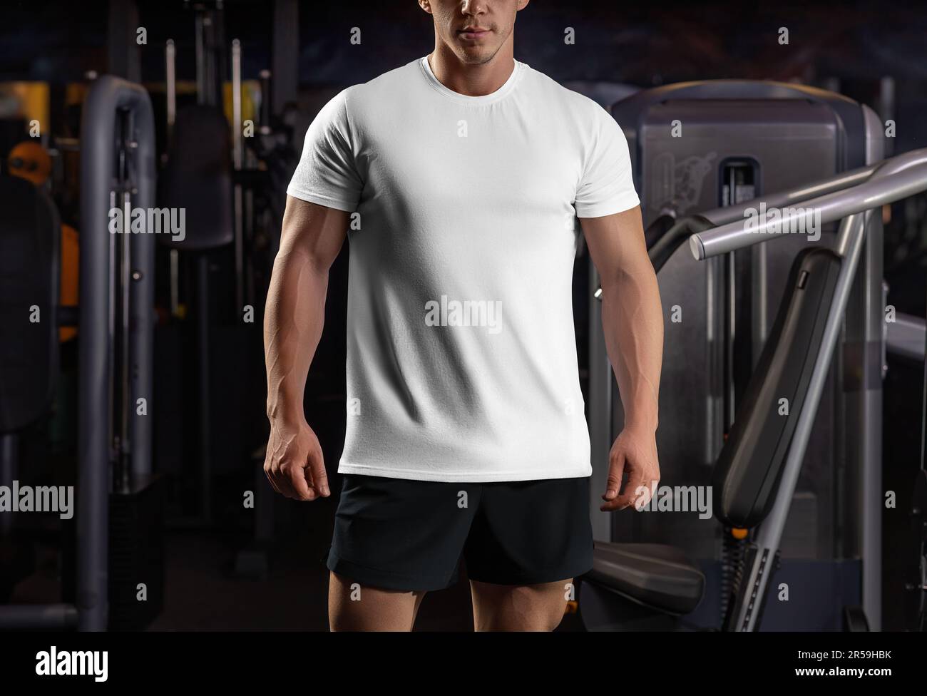Mockup of a white t-shirt on an athlete in the gym, sportswear for the ...