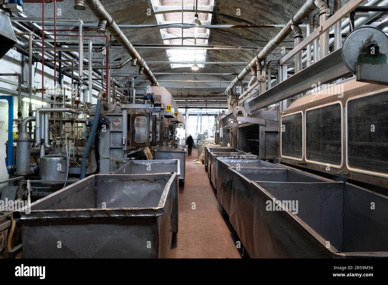A textile factory in Prato, Italy. The textile district of Prato is the biggest cluster of Europe devoted to the production of wool yarns and fabrics. Stock Photo